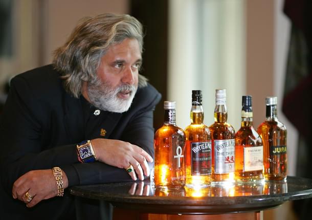 Vijay Mallya posing for the cameras after United Spirits Limited, the flagship of his UB Group, had acquired a hundred percent of scotch whisky maker Whyte and Mackay for GBP595m in 2007. (Photo credit: CARL DE SOUZA/AFP/Getty Images)